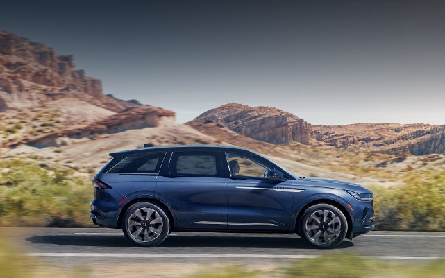 A 2024 Lincoln Nautilus® SUV is being driven in a desert setting. | Bluebonnet Motors Lincoln in New Braunfels TX