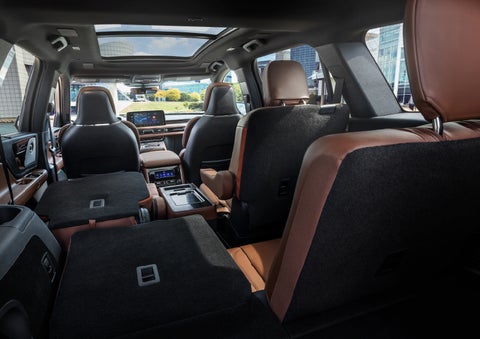 The interior of the 2025 Lincoln Aviator® SUV is shown with two seats folded down for added space. | Bluebonnet Motors Lincoln in New Braunfels TX