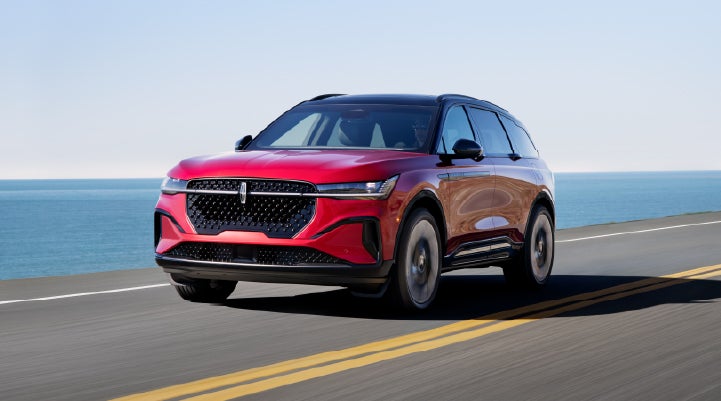 A 2025 Lincoln Nautilus® SUV is being driven on a seaside roadway. | Bluebonnet Motors Lincoln in New Braunfels TX