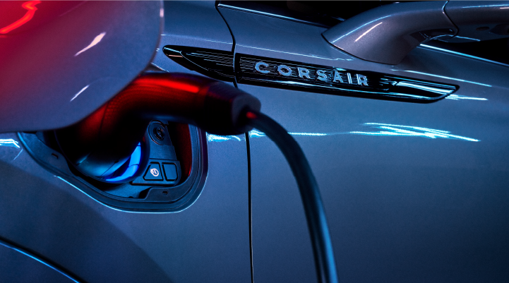A charger plugged into the charging port of a 2025 Lincoln Corsair® Plug-in Hybrid model. | Bluebonnet Motors Lincoln in New Braunfels TX