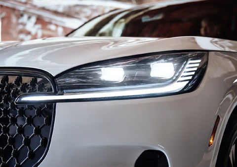 A close-up of a headlamp on the 2027 Lincoln Aviator® SUV is shown. | Bluebonnet Motors Lincoln in New Braunfels TX
