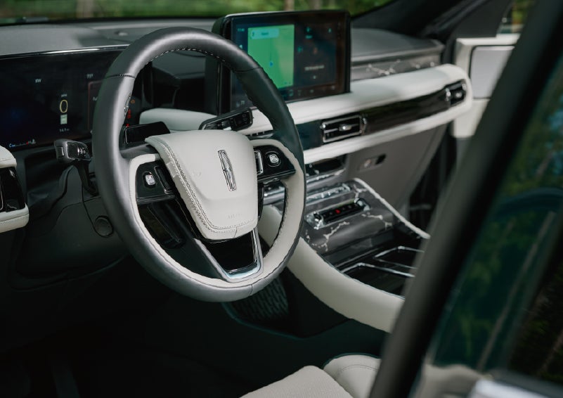The leather-trimmed steering wheel of a 2027 Lincoln Aviator® Black Label™ SUV. | Bluebonnet Motors Lincoln in New Braunfels TX